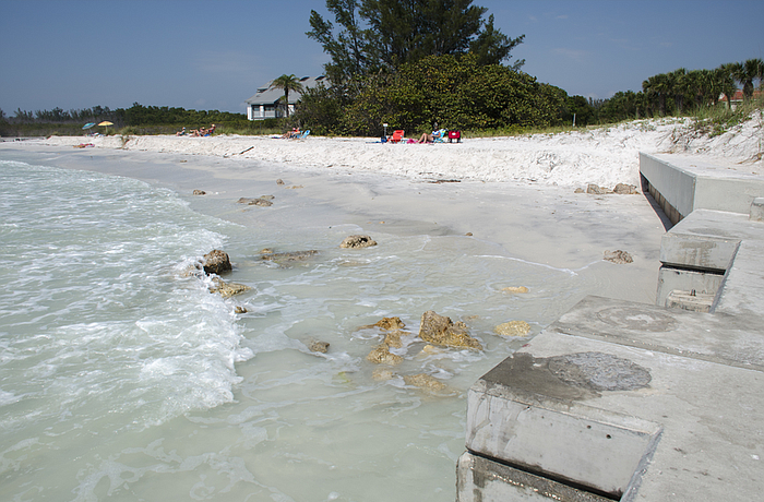High tides have eroded the beach to the point that the enscarpment â€“ a steepÂ  embankment left in the sand dune by beach erosion â€“ has eroded to the base of the southernmost groin.