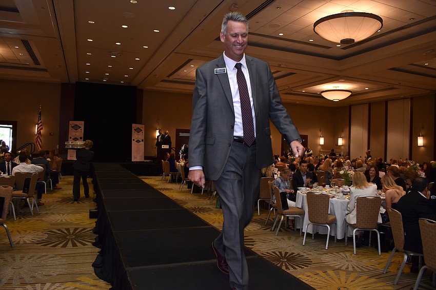 Sponsors walk the runway.