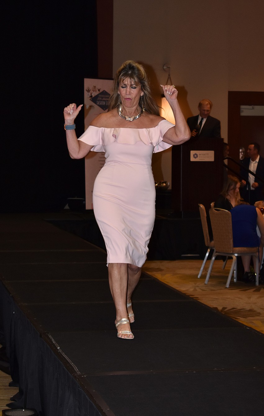 Sponsors walk the runway.