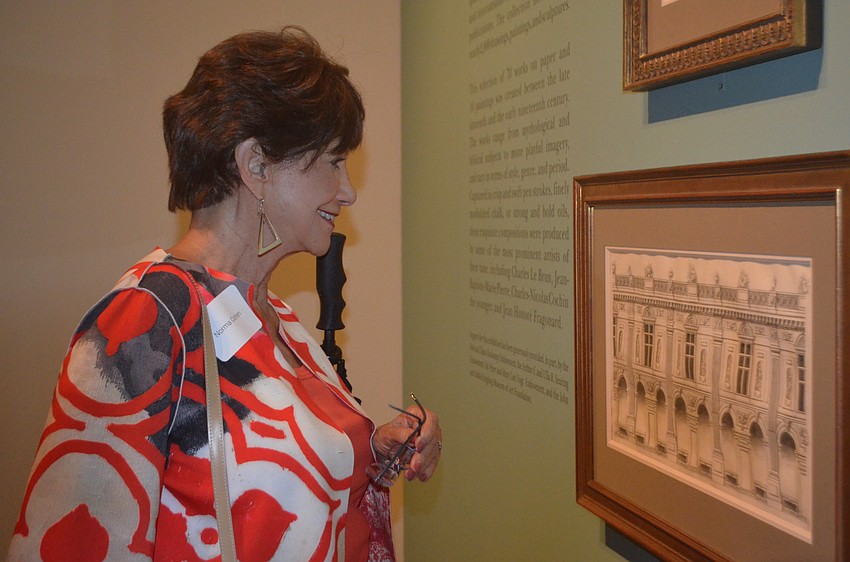 Norma Cohen views the latest exhibit.