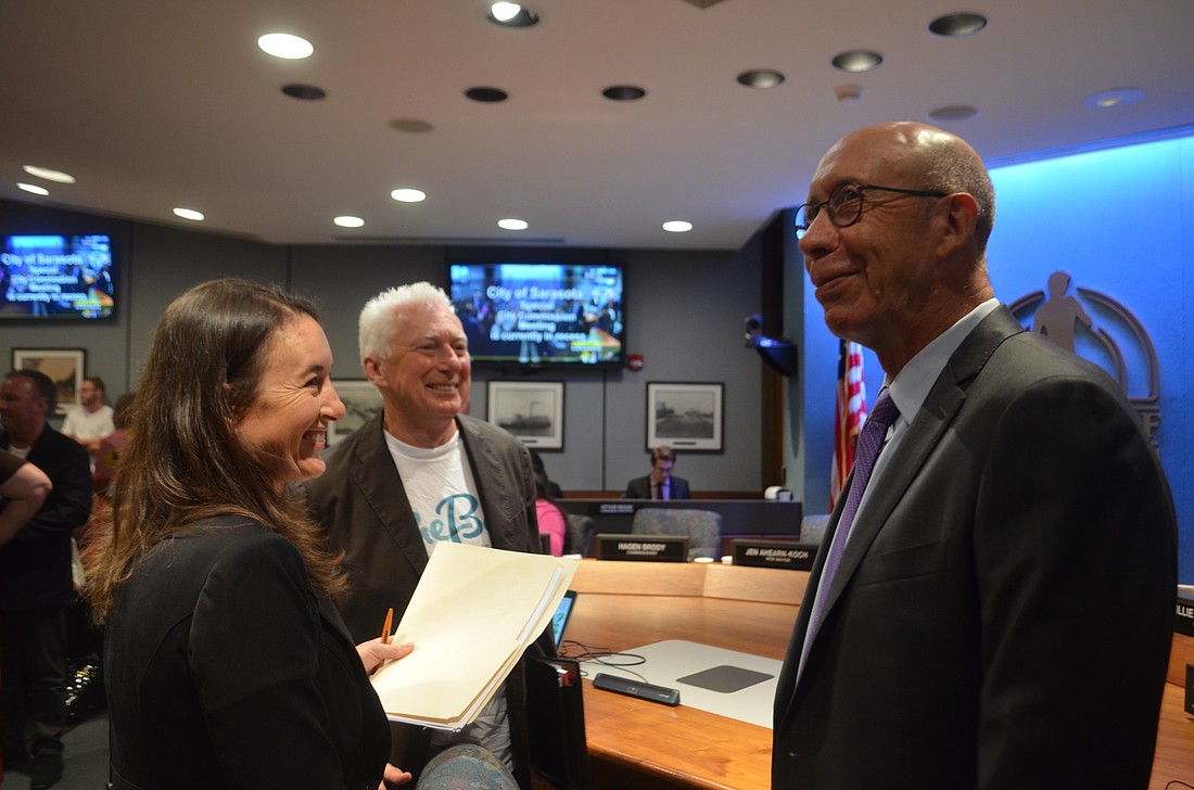 The Bay Sarasota board members Jennifer Compton and A.G. Lafley chat with City Manager Tom Barwin at a special City Commission meeting Thursday.