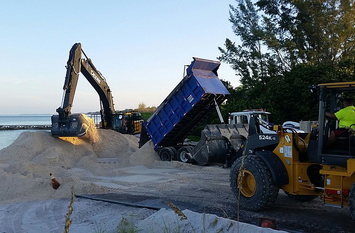 Work crews begin spreading the first loads of sand on a renourishment project on the north end of Longboat Key. (Courtesy photo)