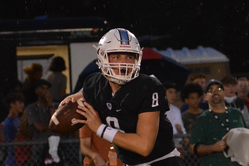 Braden River senior quarterback Bryan Gagg reads the Manatee High defense before launching a pass.