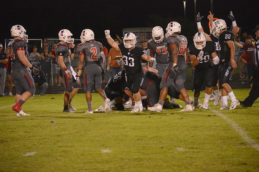 The Braden River defense celebrates after recovering a Manatee fumble.