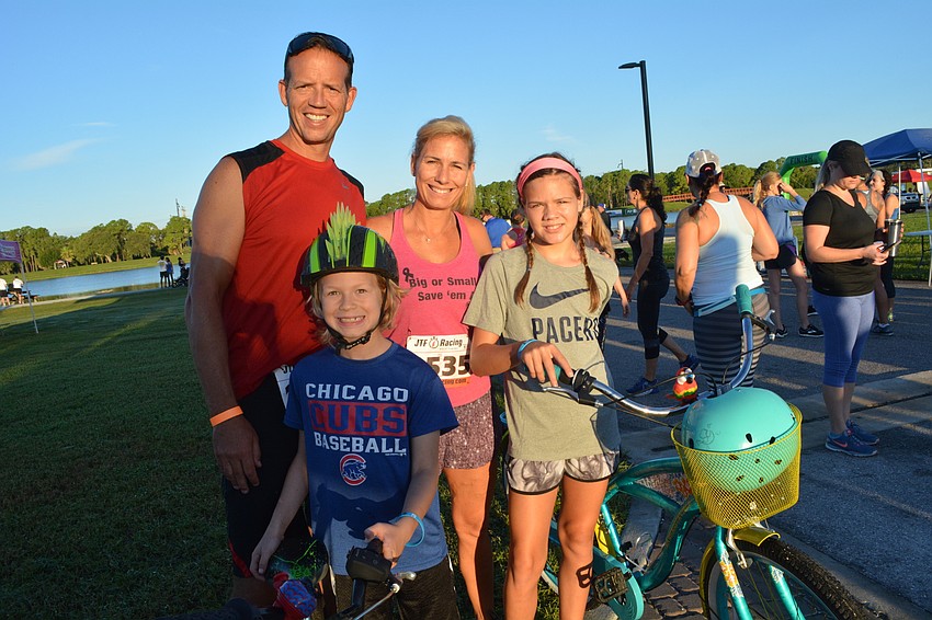 Pat and Jamie Brester, of Sarasota, ran alongside their children, Jaxon and Jadyn. They weren't worried about getting sick. 