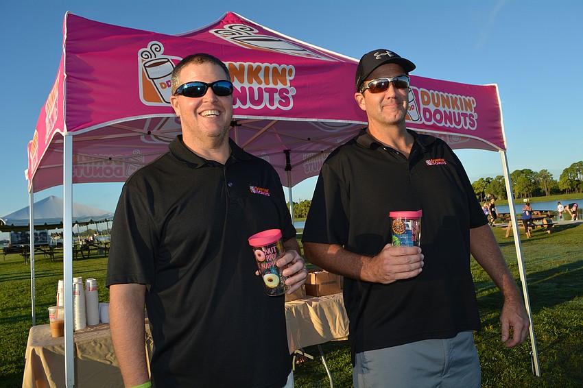 Local Dunkin' Donuts franchisees Tom Daly and Greg O'Neill doled out about 2,000 doughnuts for the event. Although 10K Donut Run runners ate plain glazed doughnuts during the race, guests eating post-race doughnuts got a variety.