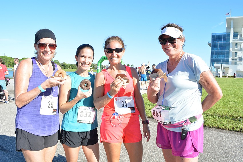 Sarasota's Kim Gibbens, Rachel Hollingsworth, Tonia Hutchinson and Jodi Perri preferred to eat their doughnuts after finishing their runs.