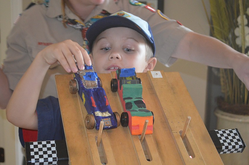 Drake Trombetta, 8, says he is a little disappointed that his car didn't win but that he wants to work with his car a little more to get it to go faster.