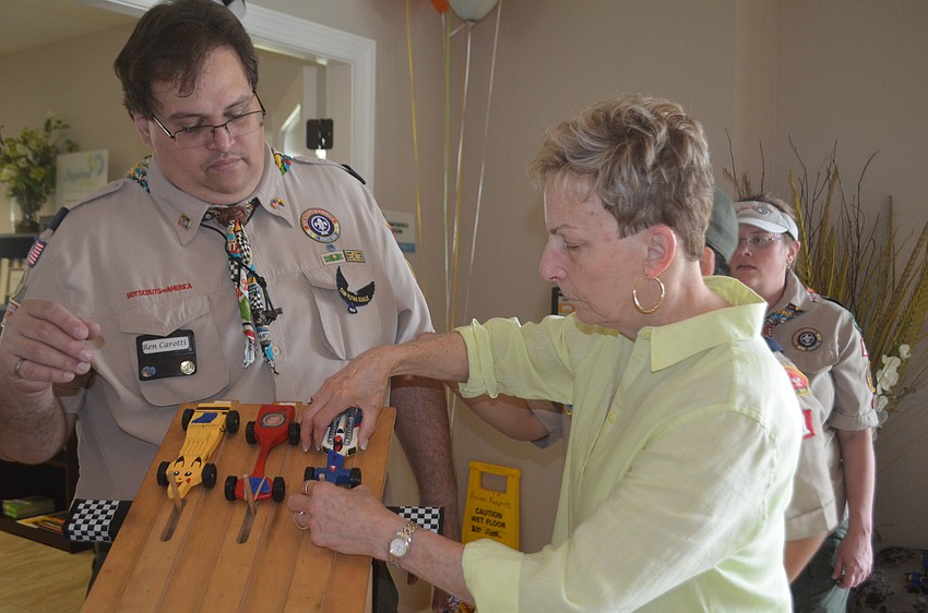 Even the seniors want to make sure that their cars are lined up for the race correctly, like Dayna Henry, who says that she wants to make sure her car wins.