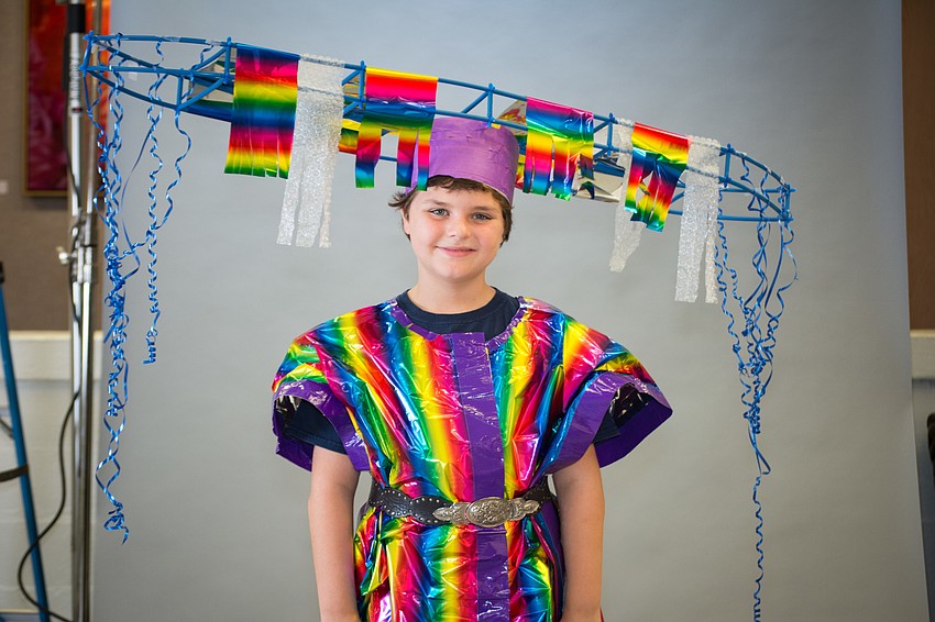 Kennedy Cole models an outfit designed by his twin brother, Avery Cole.