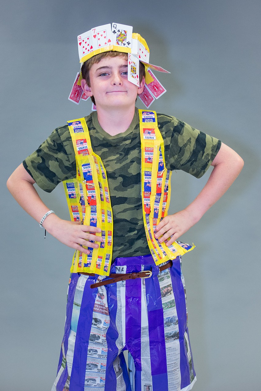 Avery Cole wears an outfit made out of newspaper, playing cards and duct tape. His twin brother, Kennedy, designed the look.