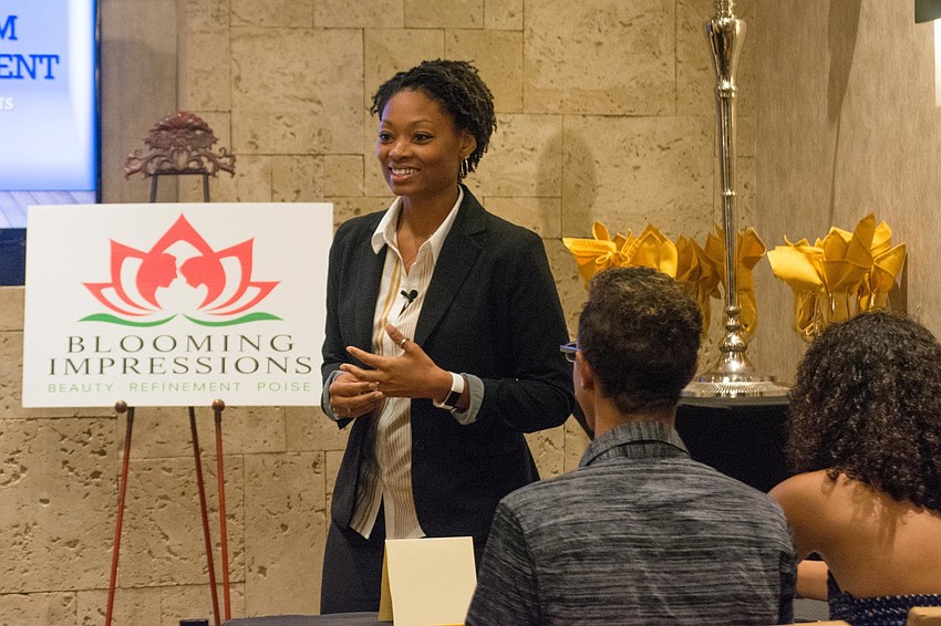 Life coach Shávon Reed leads the participants in a workshop about self-esteem.