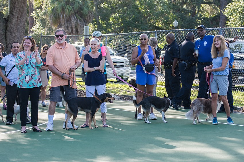 Dozens of owners and their dogs attended the opening of the Canine Club dog park.