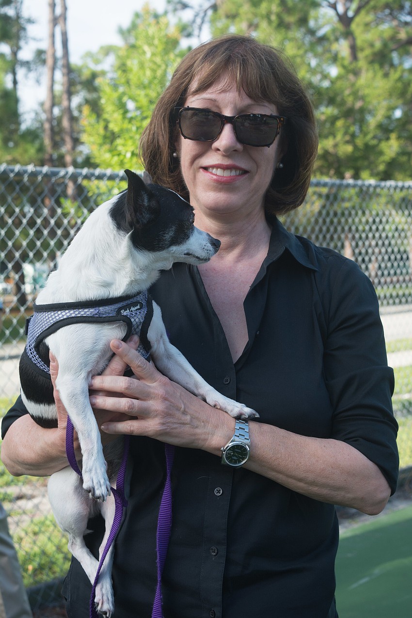 Vice Chair of City of Sarasota Planning Board Eileen Normile with her dog, Lilly.