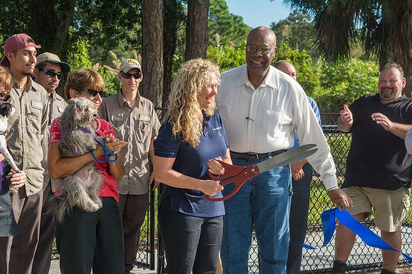 Vice-Mayor Jen Ahearn-Koch, alongside City Commissioner Willie Shaw and members of the Parks and Recreation Department, cuts the ribbon.