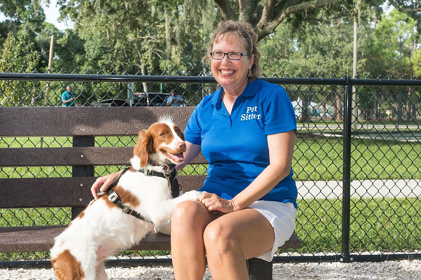 Anne Marie Schachte enjoys the new park with her dog, Coral.