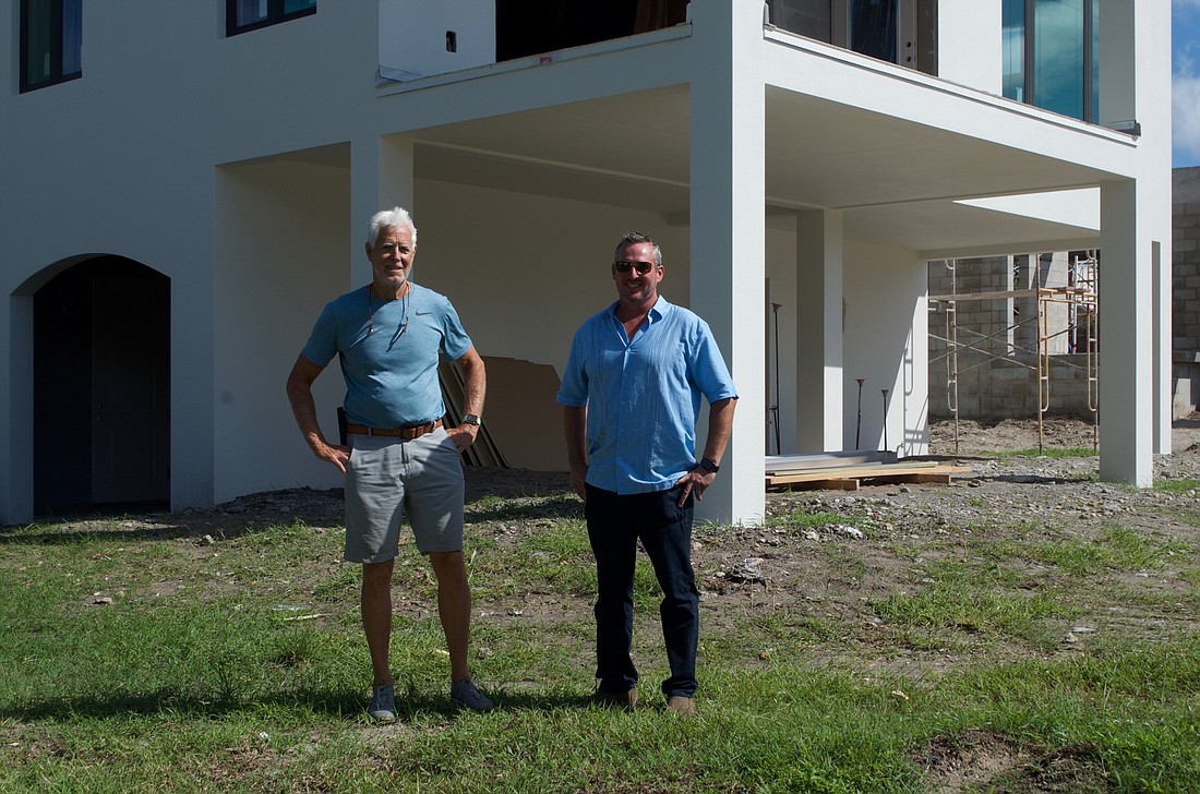 Jim Clabaugh and John Shkor stand outside model home at The Preserve.
