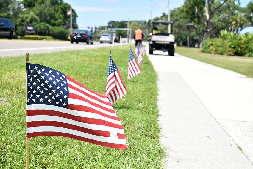 The Longboat Key Public Works Department places 2,977 flags along Gulf of Mexico Drive every year on Sept. 10 to honor those who lost their lives in the 9/11 terrorist attack.