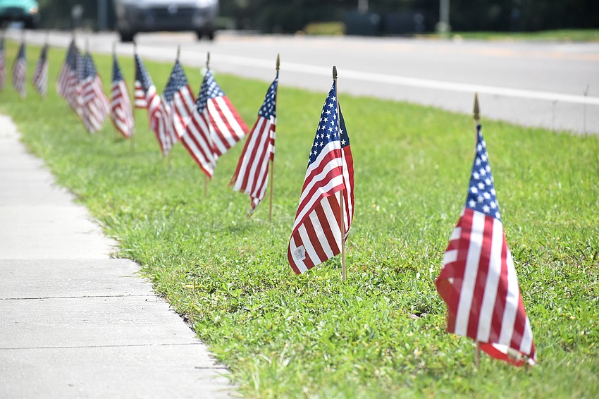 The 2,977 flags will remain standing all day on Sept. 11 and will be taken down the next day.