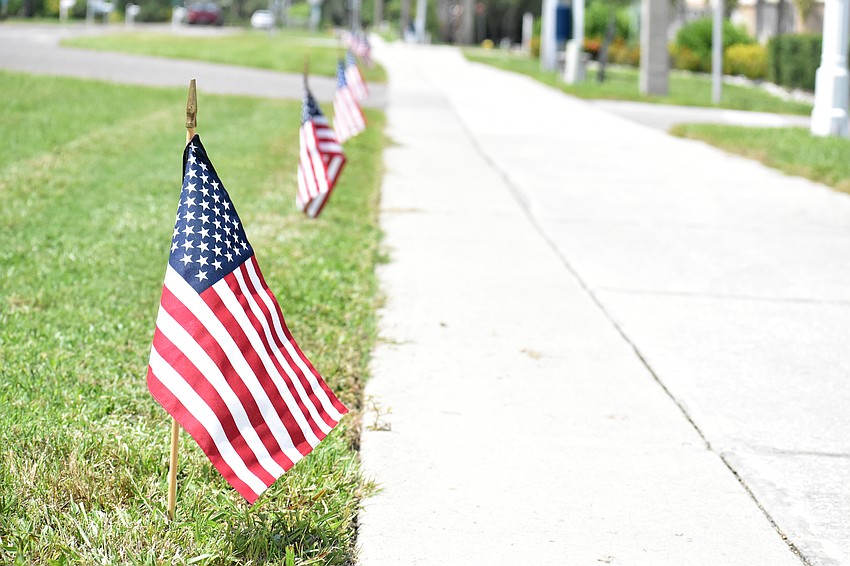 The Longboat Key Public Works Department places 2,977 flags along Gulf of Mexico Drive every year on Sept. 10 to honor those who lost their lives in the 9/11 terrorist attack.