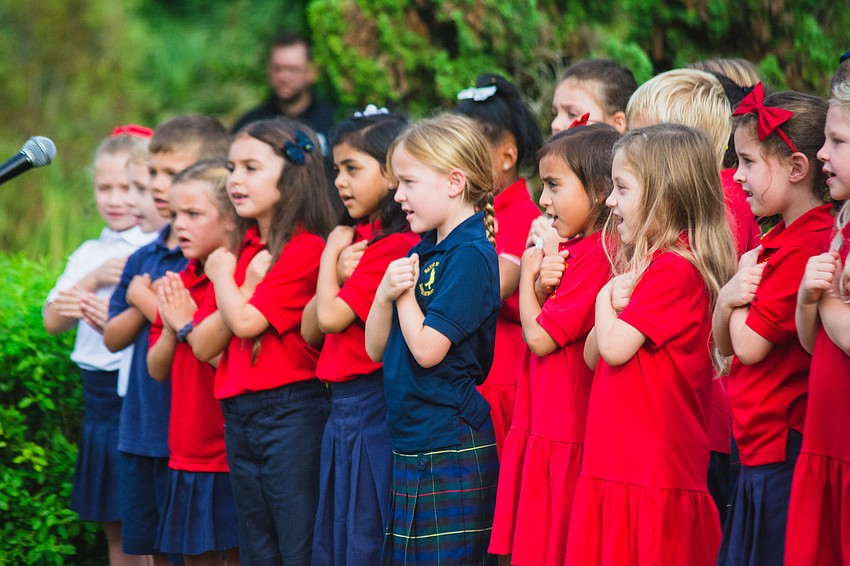 The children’s choir from Saint Stephen’s Episcopal School sing 