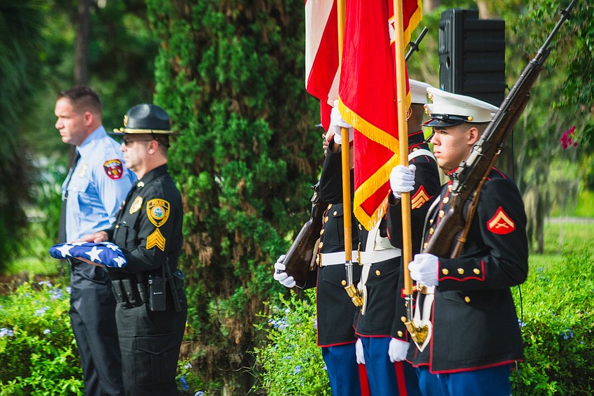 The ceremony featured the posting of the colors and the passing the flags ritual.