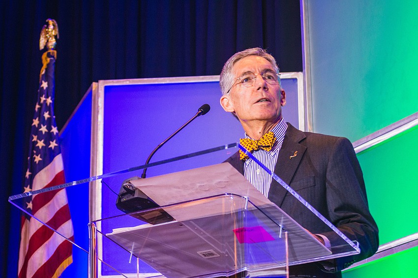 Observer Media Group Editor and CEO Matt Walsh accepts the Clyde Nixon Business Leadership Award