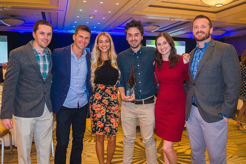 The Dealers United team with its Ringling College Innovation by Creative Design Award.