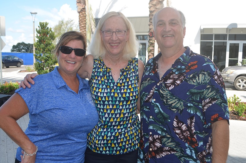 Lakewood Ranch's Susan Halsey, Mary Beth Traverso and Jay Traverso say they attended the party because they like to support local businesses.