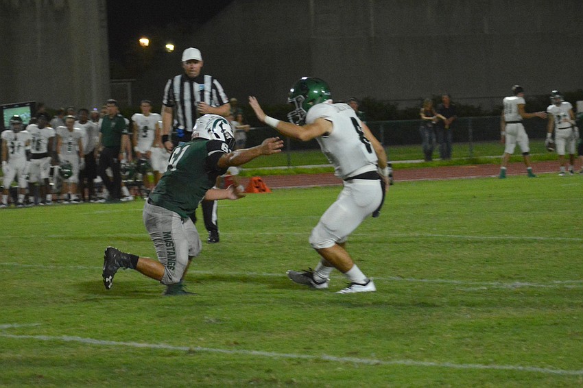 Senior defensive lineman Stefano Lonardo sacks Venice quarterback Nico Dallacosta  in the second quarter.