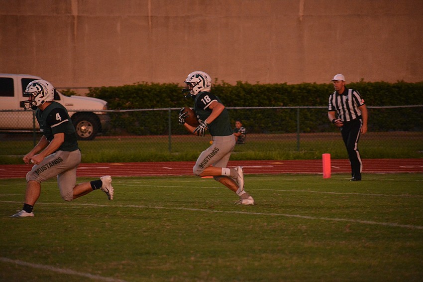 Lakewood Ranch senior Zach Younts (18) takes a Venice HIgh kickoff out of the endzone.