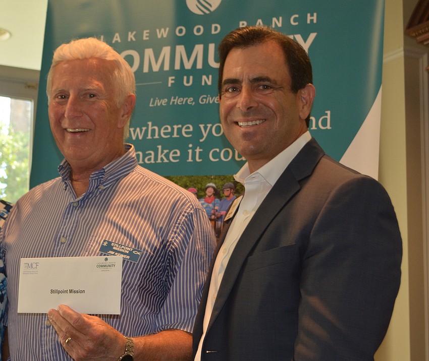 Jim Keiner of Stillpoint Mission receives the largest grant of $6,500 from board member David Fink.