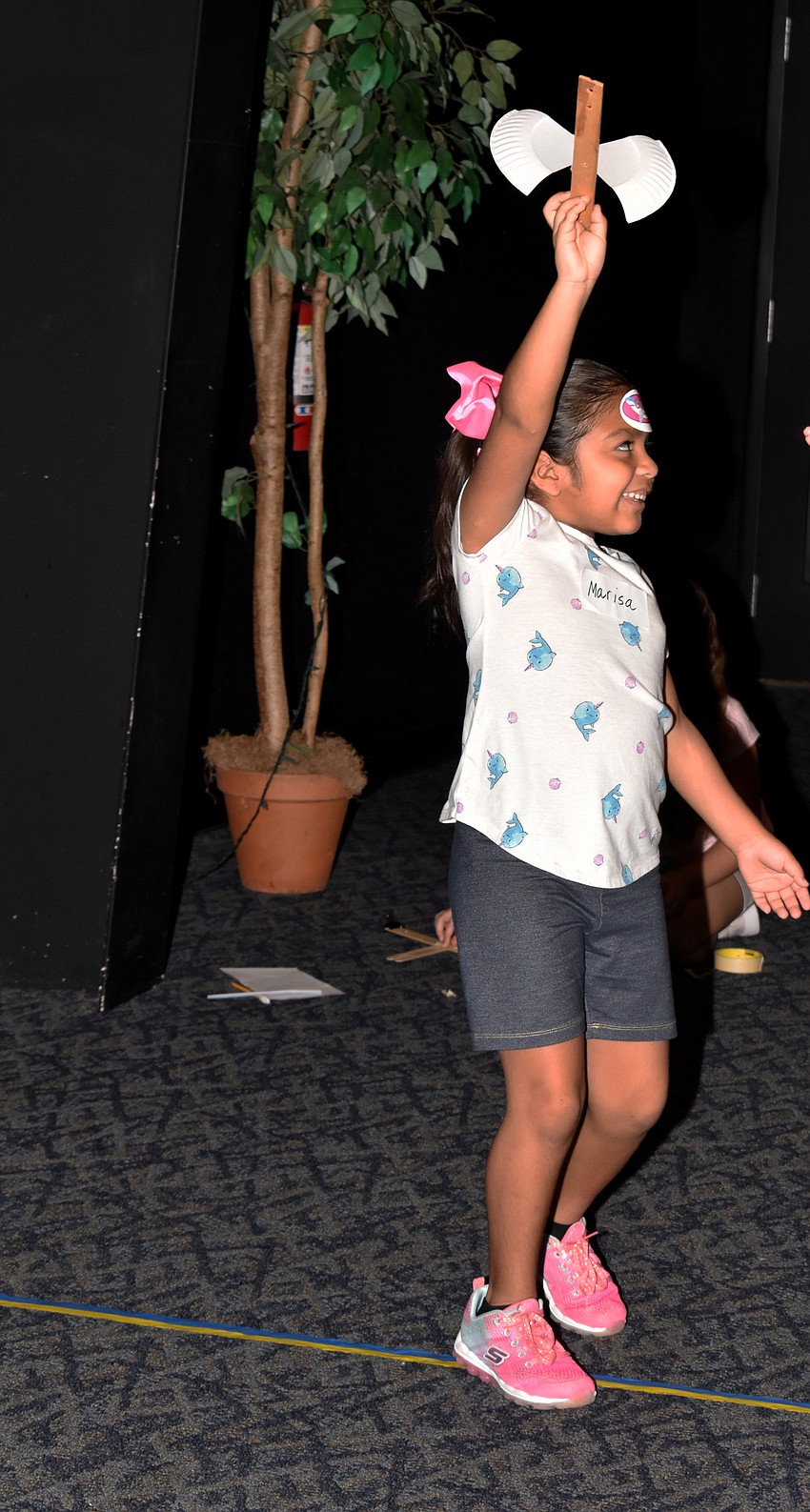 Marisa Juarez holds up her shark plane before testing it.