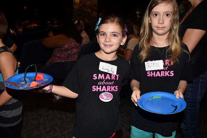 Layla Loeffel and Eira Glaab show off their shark tank replicas.