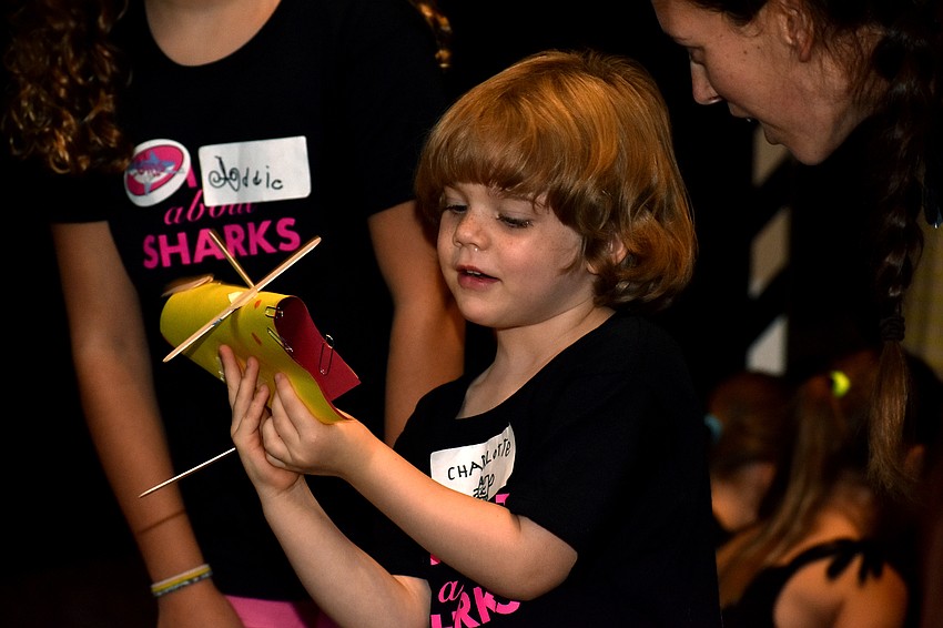 Charlotte Allen shows off her shark plane.