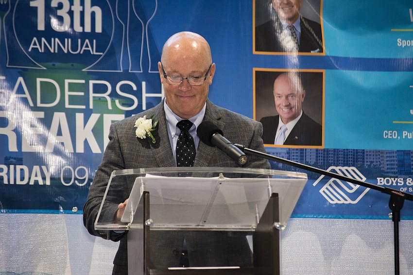 Publix Super Markets CEO Todd Jones accepts an award.