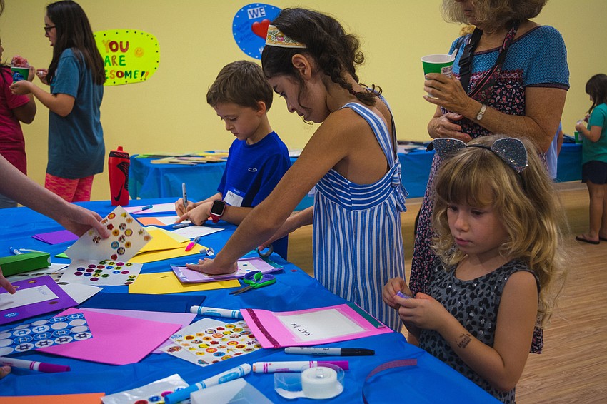 Students create holiday-themed crafts.
