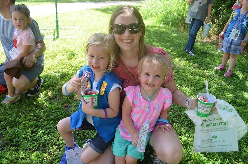 It might have been hot at Camp Honi Hanta but Parrish's Emma Bentley, 5, Cara Bentley and Avery Bentley, 2, cooled off with a snow cone
