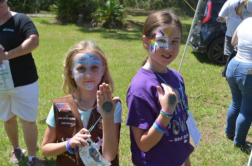 North Port's Rebekah Rigsby, 8, and Krysalea Rogers, 9, from Troop 498,  got temporary tattoos because the process involved  wet towels that cooled them down.