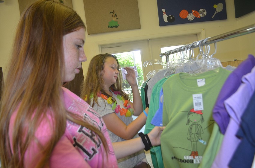 Bradenton's Kaeli Freshour, 13, and Victoria Moore, 13, of Troop 140 found time to do some shopping.