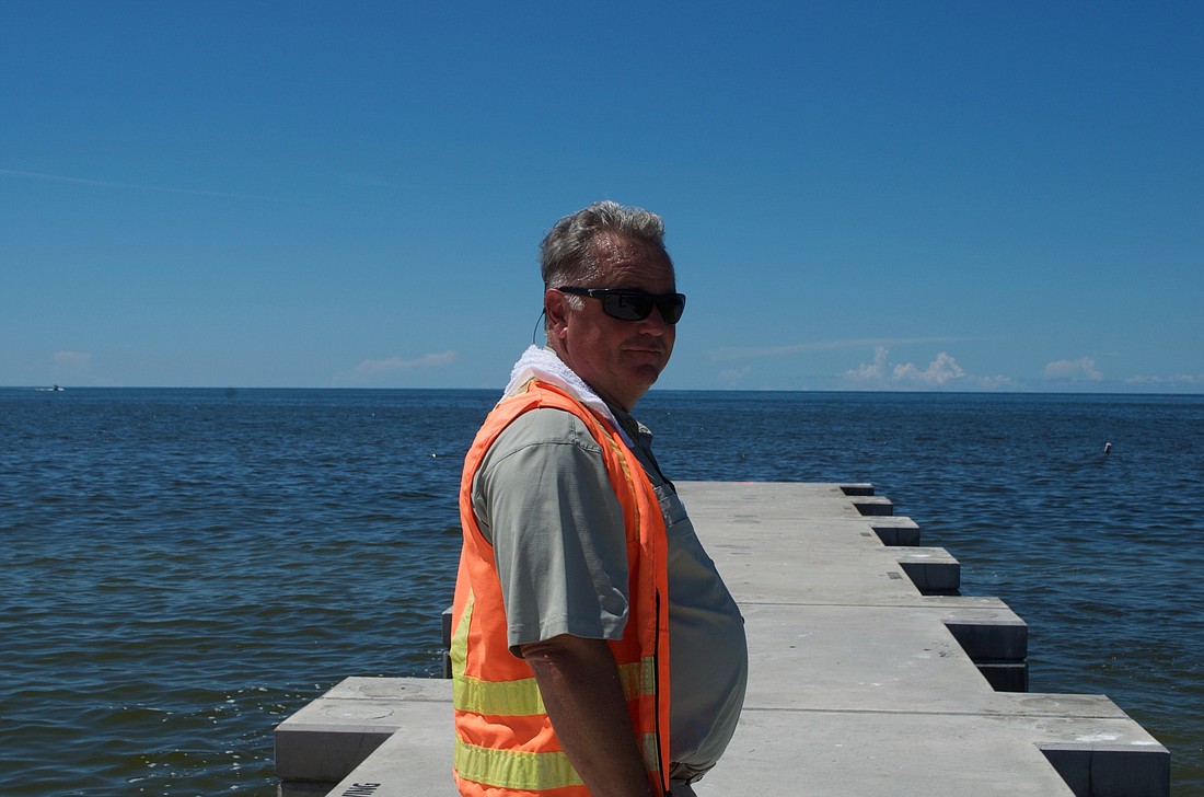 Bem Smith, project manager for Longboat&#39;s beach nourishment project, stands on North Shore Road groin.