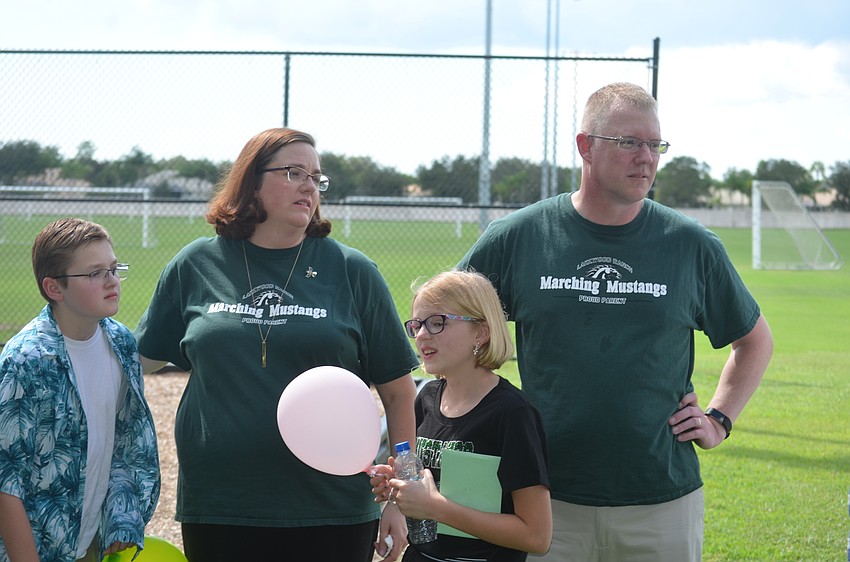 Robert Powers, 13, Rebecca Powers, Katie Powers and Dan Powers say that their son Matthew Powers would love all of the students in their Hawaiian shirts.