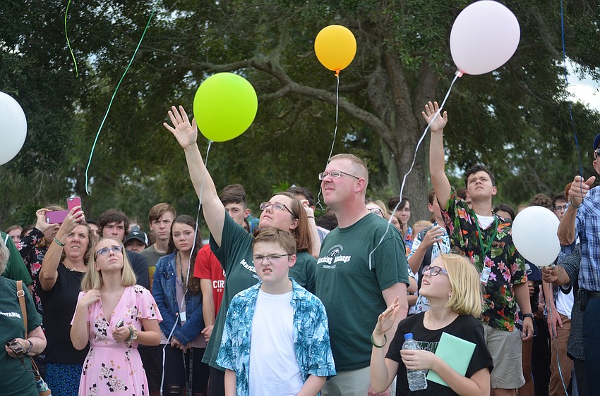 Robert Powers, Rebecca Powers, Dan Powers and Katie Powers release balloons in honor of Matthew Powers and Chase Coyner.