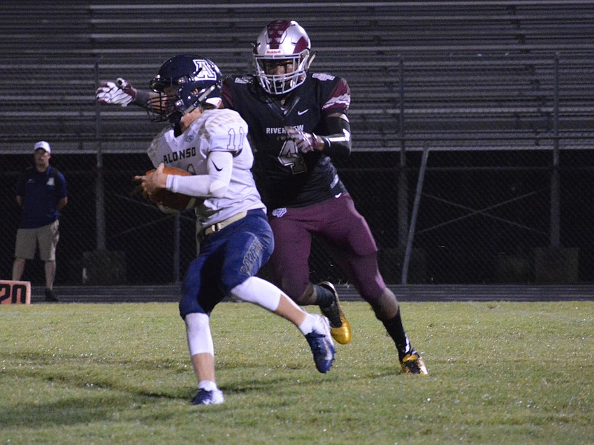 Junior defensive end Jayden Cray tracks down Alonso's quarterback for a sack.