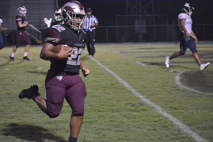 Senior running back Ali Boyce jogs into the end zone untouched for a Rams touchdown.