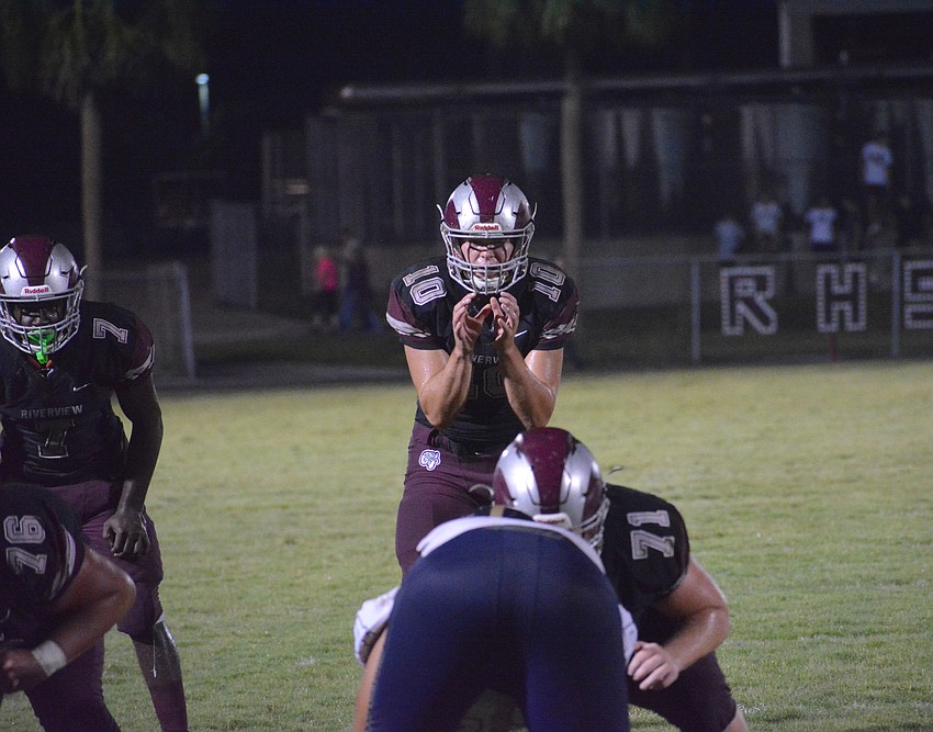 Quarterback Sean White calls out pre-snap instructions in the red zone.
