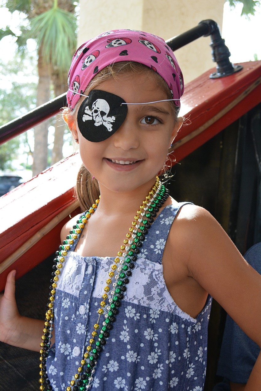 Tara Elementary School's Mia Turasz, 6, gets a front row spot with her brother, Jaxon, and cousin, Lucas Turasz, not pictured.
