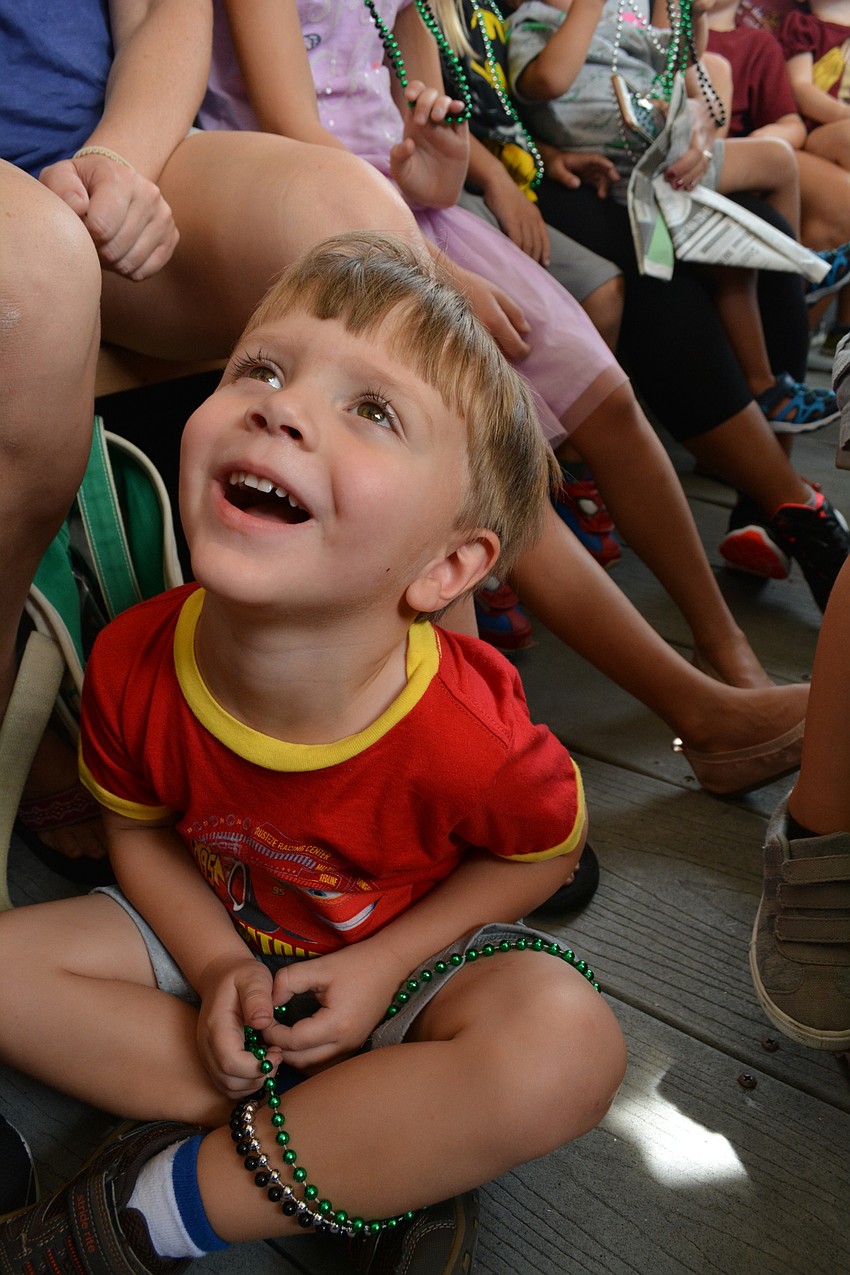 Arthur Church is captured by story time. He made crafts, including a pirate ship made from paper and a straw, before boarding the pirate ship.