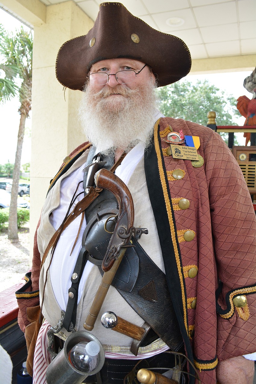 Capt. Barbarosa, known to his friends as John Swager, shows off the nine weapons he carries as a pirate.
