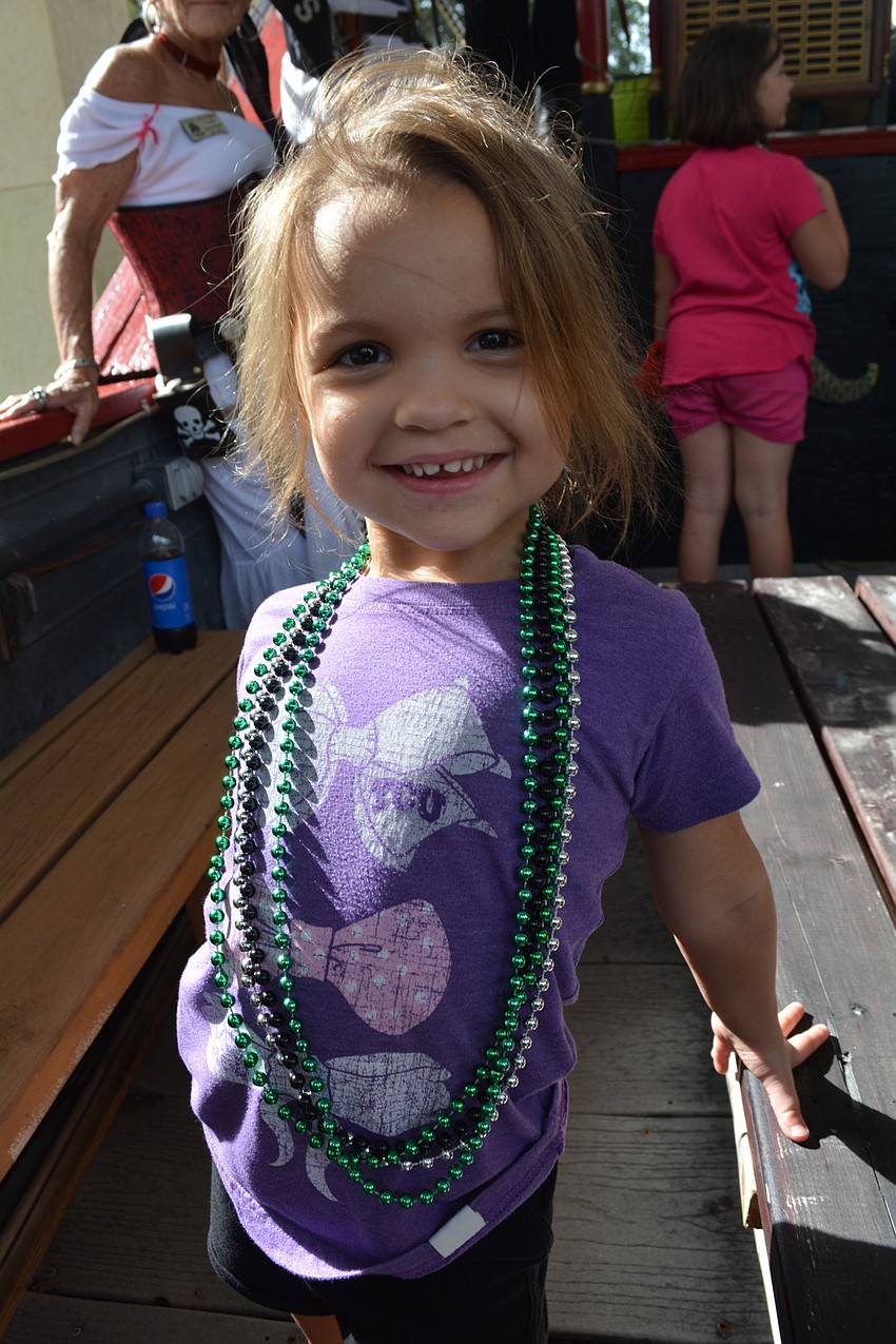Palmetto's Julia Peavler, 3, loves the necklaces the pirates gave her.